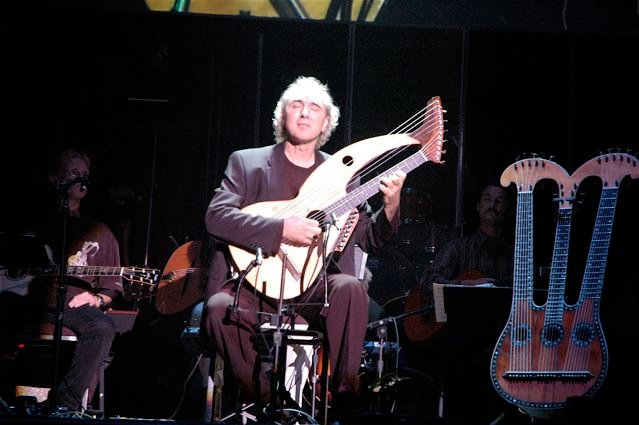 John Doan pefforms on harp guitar in concert.