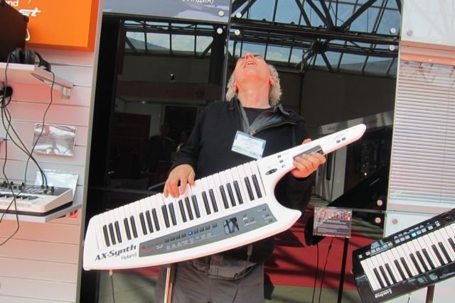 John Doan jamming on an electric piano guitar in Moscow.