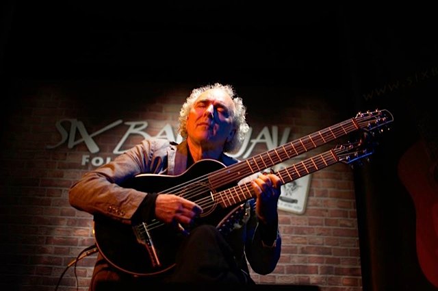 John Doan peforms at the Six Bar Jail with the harp guitar.