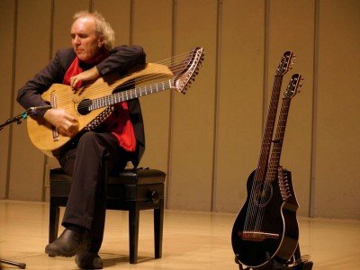 John Doan Xian China playing harp guitar on stage